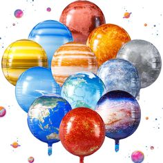 a bunch of balloons that are in the shape of planets and stars on a white background