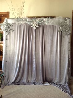 the curtains are closed and ready to be used as a backdrop for a wedding ceremony