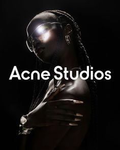 an african woman with dreadlocks and light on her face is featured in the ad for acne studios