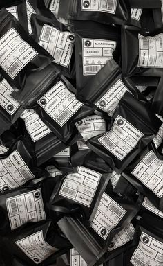 black and white photograph of bags of food that are stacked on top of each other