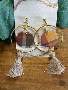 Bold Statement Paper Earrings.    These lovely fall collection in plaid are a must have for your collection. Hoops with tassels -  3 1/2 inches in length and 1 3/4 inches wide. Circular with gold glitter - 2 styles -   2 inches in length and 1 inch wide. Curved design with accessory and wood ear posts. Large Tear Drop with Glitter insert -    2 1/2 inches in length and 1 inch wide. Gold Hoops with Half Moon and dangling accessory -   2 1/4 inches in length and 1 3/4 inches wide. Plaid Earrings with Silver Ear Posts -    2 inches in length and 1 1/4 inches wide. Plaid Earrings with Gold Ear posts -  1 3/4 inches in length and 1 inch wide. Great look for that special occasion or everyday wear. These earrings are water resistant but NOT waterproof. Plaid Earrings, Elephant Purse, Bold Statement Jewelry, Marble Earrings, Paper Earrings, Retro Earring, Curve Design, Patriotic Gifts, Beaded Dangle Earrings