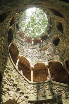 the inside of an old stone building with a round window in it's center