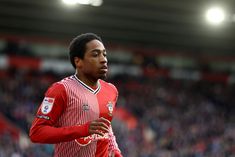 a soccer player is running on the field