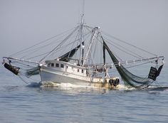 a fishing boat with nets in the water