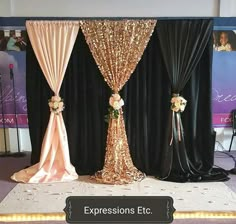 an image of a stage set up with flowers and sequins on the curtain