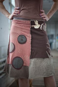 a woman is wearing a skirt made out of fabric