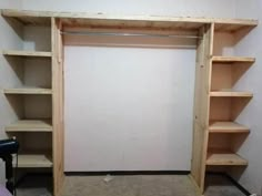 an empty closet with shelves in it