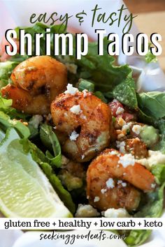 shrimp taco salad with lettuce and feta cheese on top in a white bowl