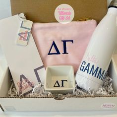 a gift box with personal items in it including a bottle, dishwasher and soap