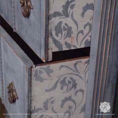 the drawers are painted with blue and white designs