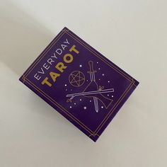 a purple tarot box with the words every day tarot written in gold on it