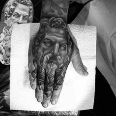 a man's hand with a tattoo on it