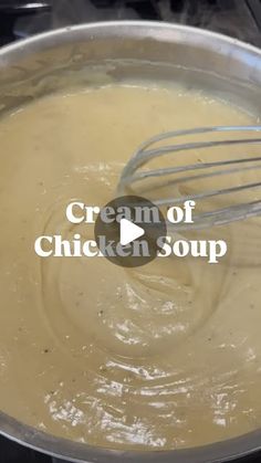 the cream of chicken soup is being stirred with a whisk