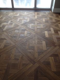 the floor is made out of wood and has an interesting pattern