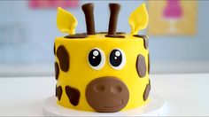 a giraffe cake with chocolate decorations on it