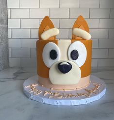 a cake with a dog's face on it