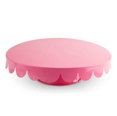 a pink cake plate with scalloped edges on a white background, it is also available for use as a serving platter