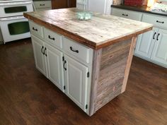 a kitchen island made out of wooden planks