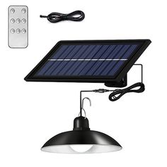 a solar powered light and remote control on a white background