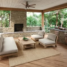 an outdoor living area with furniture and a fireplace