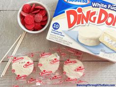 the ingredients to make white fudge cake are displayed on a table with candy sticks