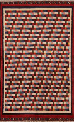 a multicolored quilt with squares on it