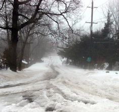 the road is covered in snow and ice