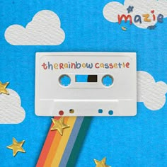 an old fashioned cassette with the word'the rainbow castle'written on it and gold stars