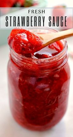 fresh strawberry sauce in a glass jar with a wooden spoon on the side and text overlay