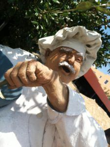 a statue of an old man holding a spoon in his hand with the words, my favorite cooking tips