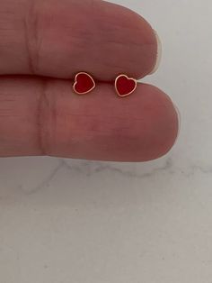 14K Solid Gold Red Heart Earrings | Dainty Red Hearts | Heart Stud Earrings | Red Earrings | Dainty Solid Gold Studs♦ Materials: 14K Gold♦ Available colors: Yellow Gold & Enamel ♦ Closure: Screw Backs♦ Earrings Measurements: Hearts are 5x5 Millimeters, please review the actual dimensions, since the photos have been enlarged. These earrings can be bought for toddlers or adults------------------------------------------------------------------------------------------PRODUCTION TIMESOrder processing Cheap Dainty Heart Earrings, Red Heart Earring Stud, Cheap Dainty Heart Earrings For Pierced Ears, Stud Girl, Heart Piercing, Red Heart Earrings, Pink Studs, Yellow Heart, Heart Stud Earrings