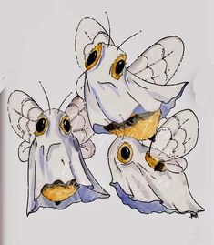 three white birds with yellow eyes and wings