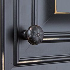 a black door with a metal handle on it