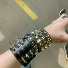 Spike Bracelet Punk Rock, Lots Of Bracelets On Wrist Grunge, Punk Bracelets Aesthetic, Emo Bracelets Aesthetic, Spike Bracelet Aesthetic, Spiked Choker Outfit, Spikey Bracelets, Alt Bracelets, Punk Wristband