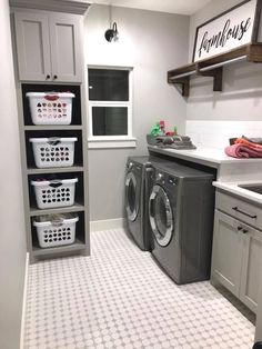 a washer and dryer in a small room with white tile flooring on the walls