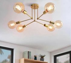 an image of a light fixture in the middle of a room with bookshelf