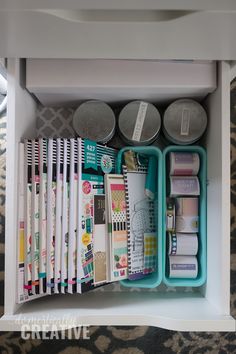 an organized drawer filled with crafting supplies