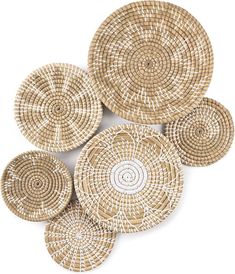 six woven baskets are arranged on top of each other, with white circles in the middle