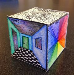 the cube is made out of colored paper and has an open door on it's side