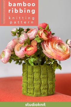 a green knitted vase with pink flowers in it and the words bamboo ribbing knitting pattern