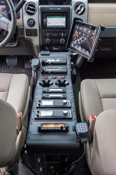 the interior of a vehicle with dashboards and steering wheel controls