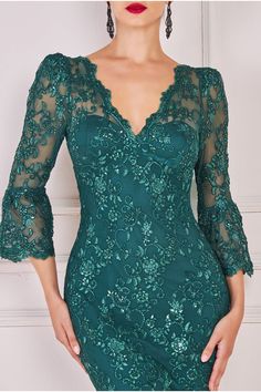 Experience exquisite charm with our Lace Scallop Midi Dress. This emerald dress is designed for those seeking timeless allure, featuring intricate scalloped detailing along the neckline, sleeve, and hem. The alluring v-neckline and sheer lace sleeve embrace a bodycon fit that effortlessly accentuates your silhouette. From dinners to date nights, and even special occasions like weddings, this emerald dress is your go-to for a range of semi-formal events. The delicate lace and thoughtful scalloped Dresses By Texture, Detail Couture, Emerald Dress, Clothing Pattern Design, Lace Dress Design, Emerald Dresses, Green Lace Dresses, Elegant Dresses Classy, فستان سهرة