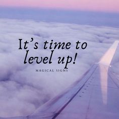 an airplane wing with the words it's time to level up above the clouds