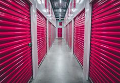 rows of red storage units lined up against the wall