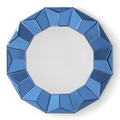 a round mirror with blue geometric shapes on it