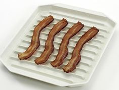 bacon strips are on top of an electric grid