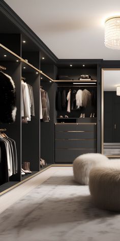 a large walk in closet with lots of clothes