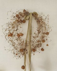 a dried wreath hanging on the wall