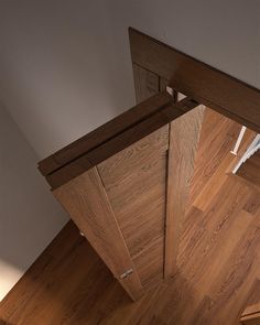 an overhead view of a wooden door in a room