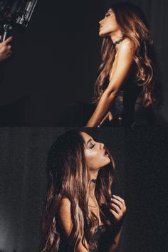 a woman with long hair standing in front of a camera and looking up at the sky